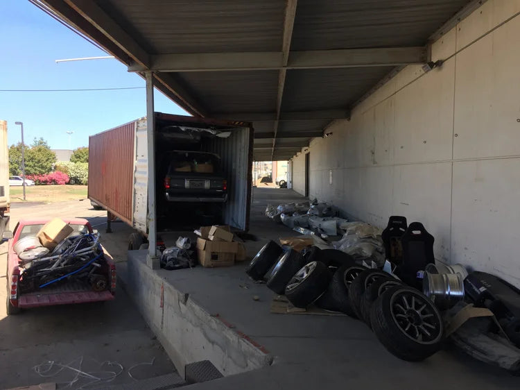 Container loading with car parts and wheels
