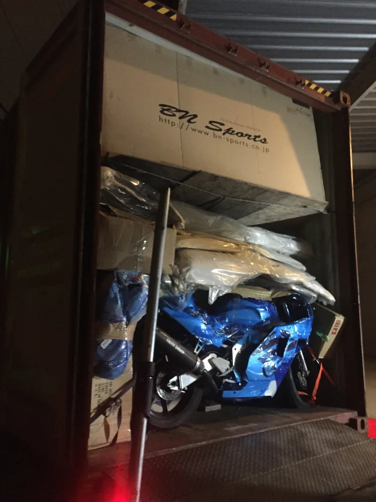 Packed motorcycle inside shipping container